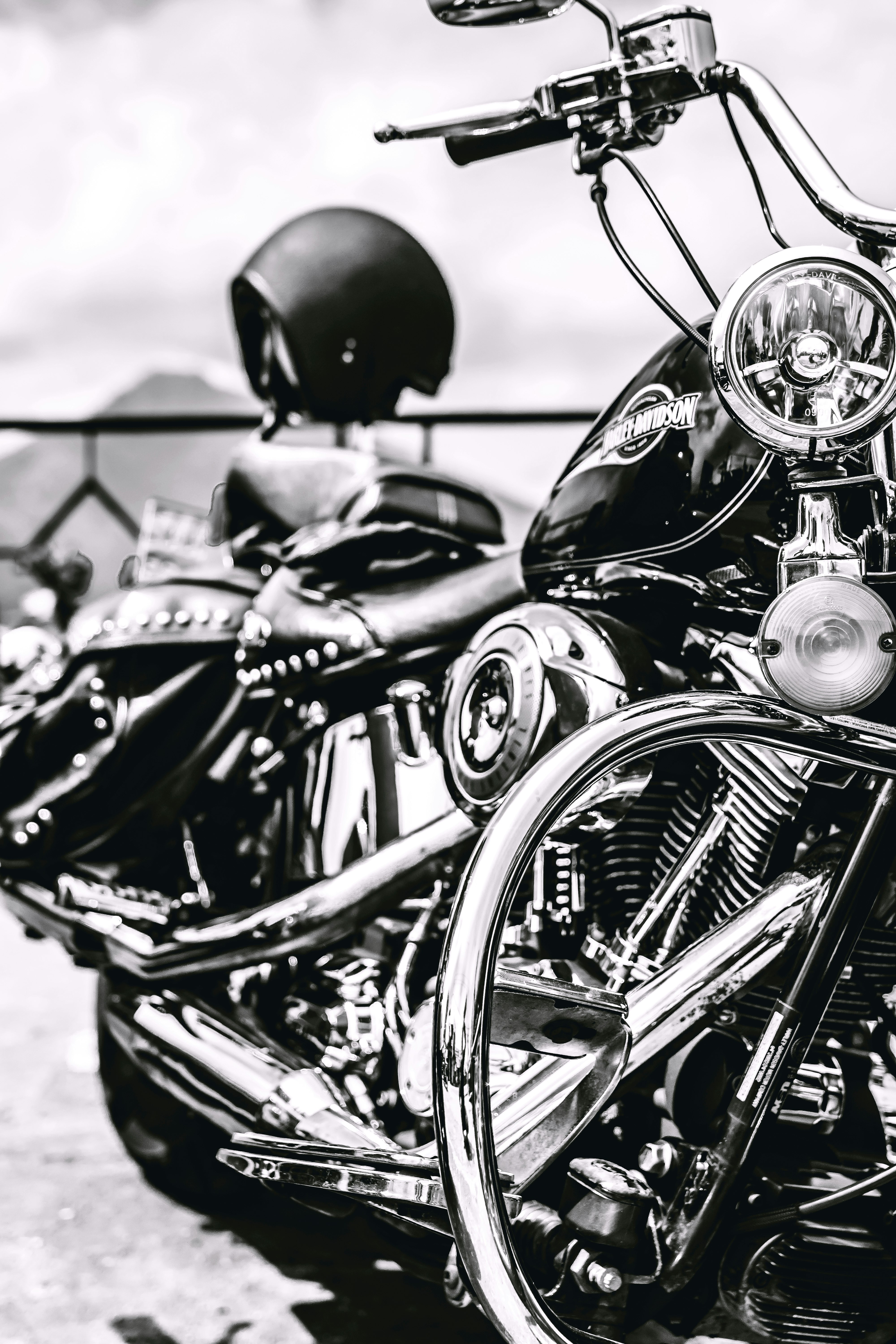 black motorcycle in grayscale photo